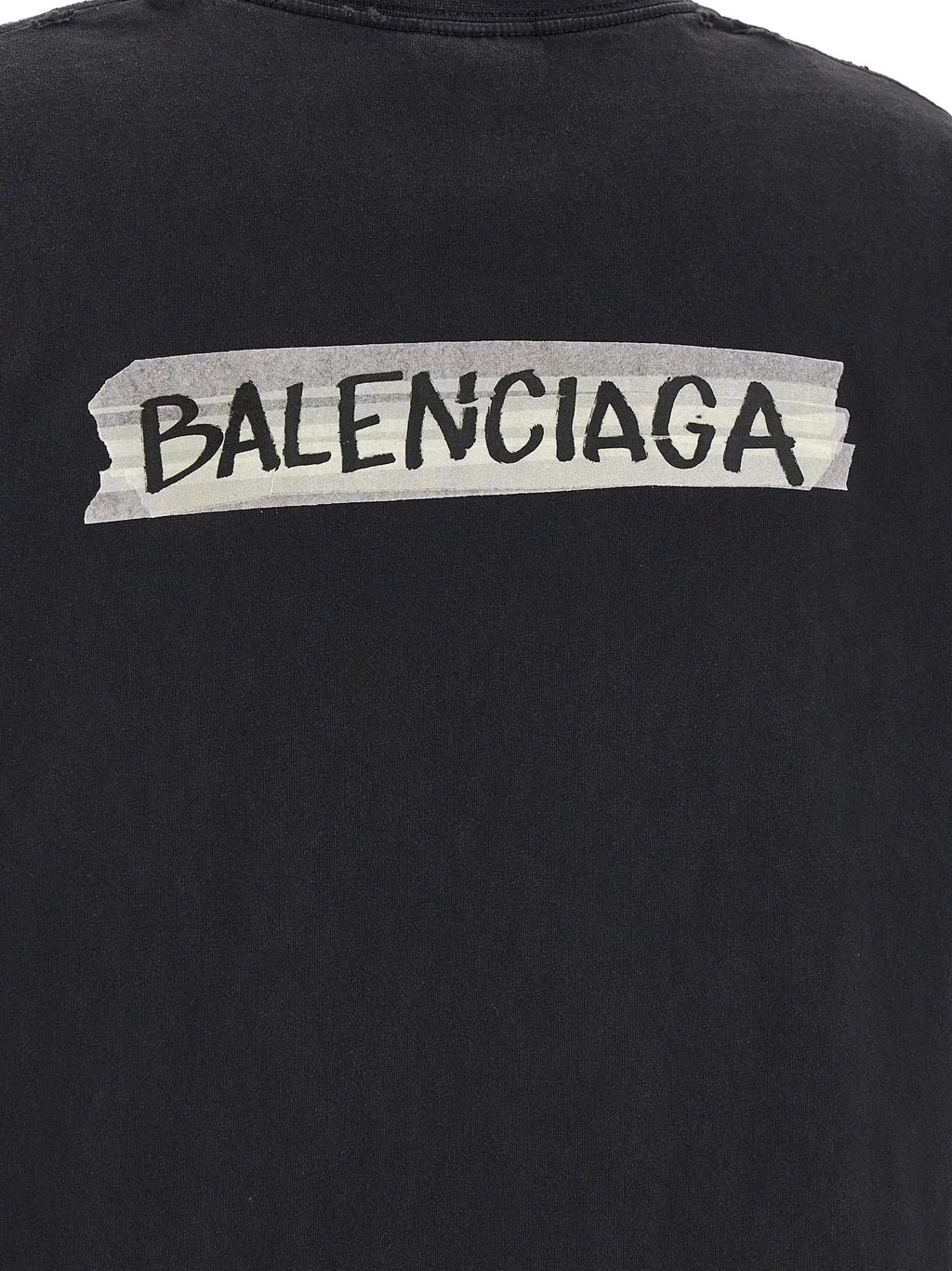 Vue arrière du t-shirt balenciaga noir en coton avec le logo en lettres noires sur bande blanche au dos