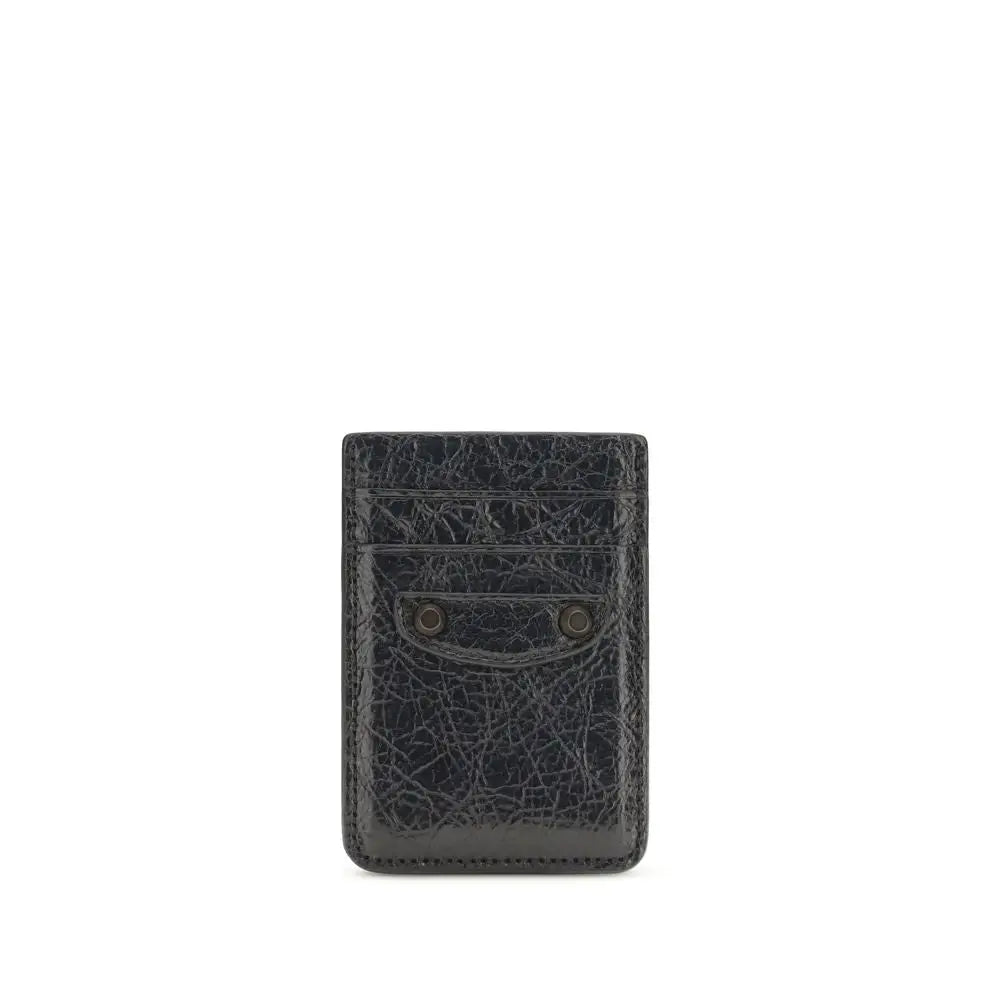 Porte-cartes balenciaga en cuir noir texturé avec deux rivets métalliques pour un style élégant