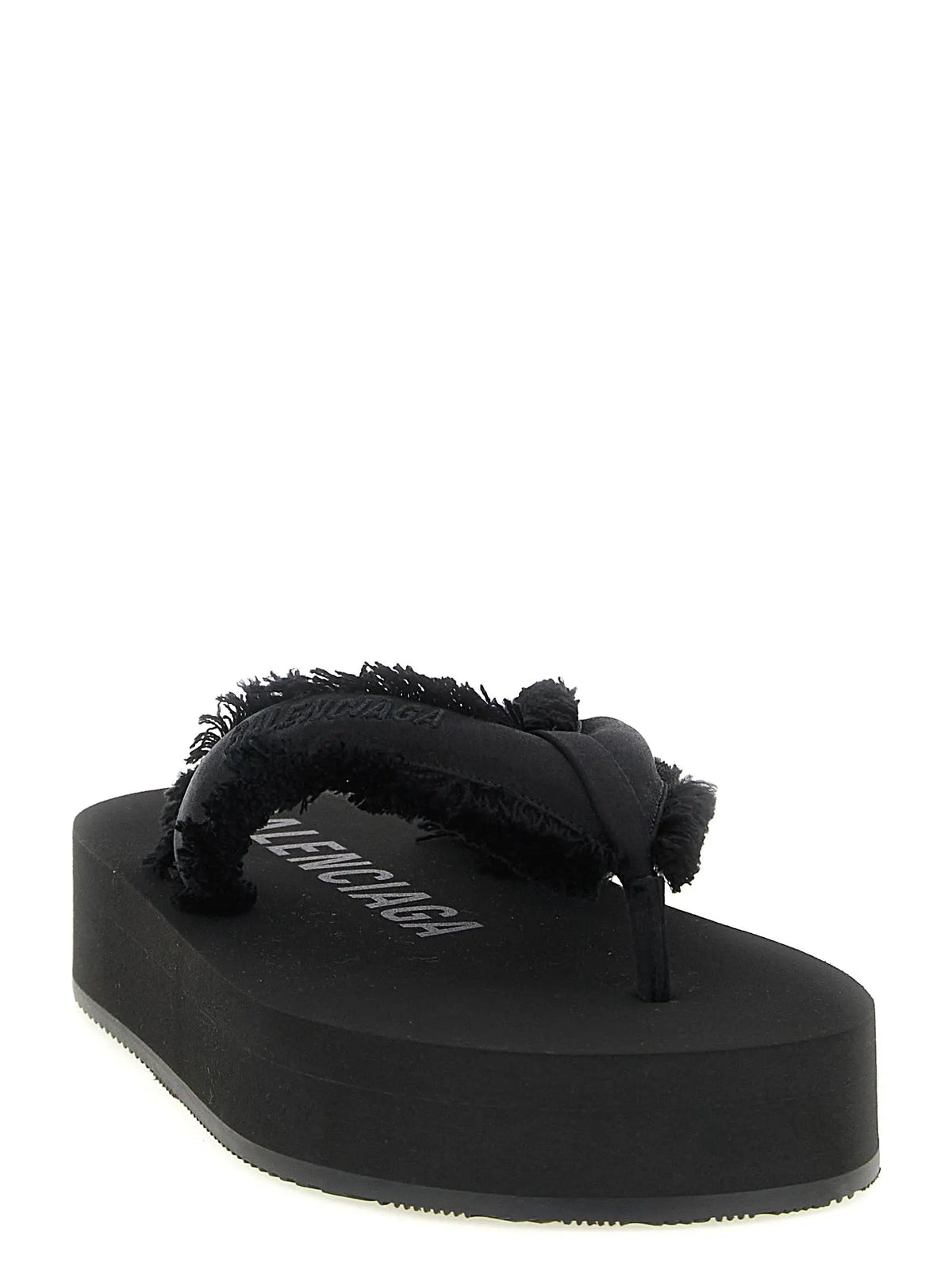 Balenciaga black viscose slides with a black platform flip-flop and frayed textured strap with balenciaga print