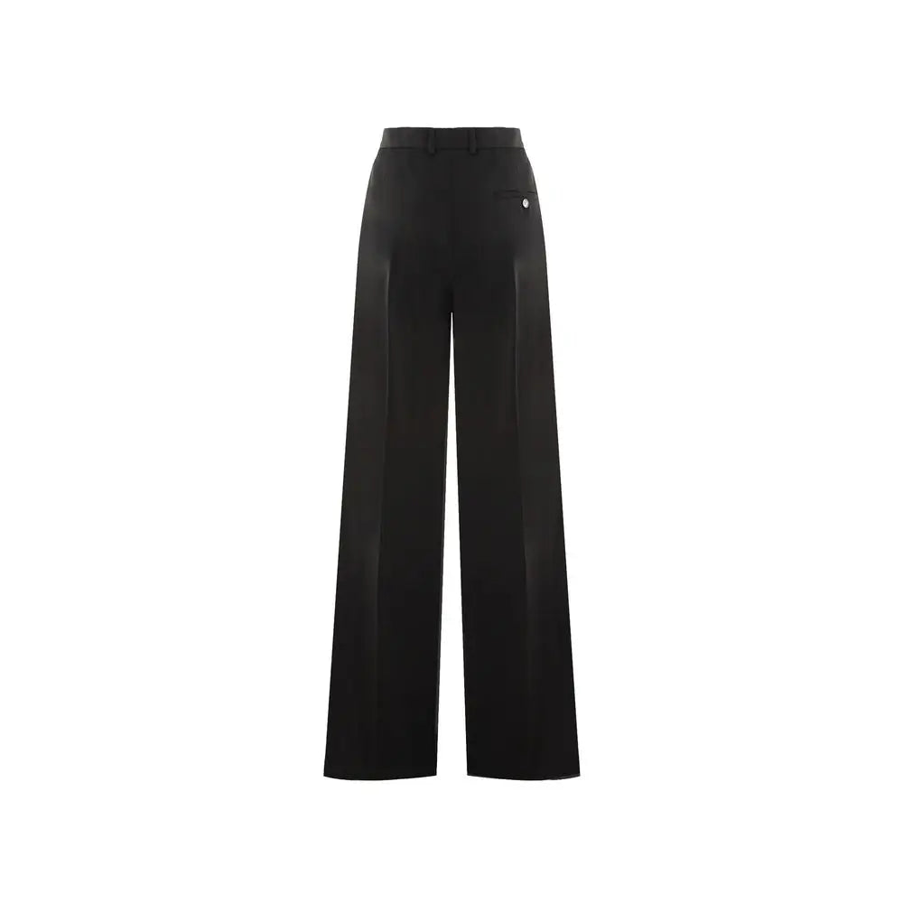 Pantalon évasé en laine noir balenciaga avec coupe taille haute large et plis discrets à lavant