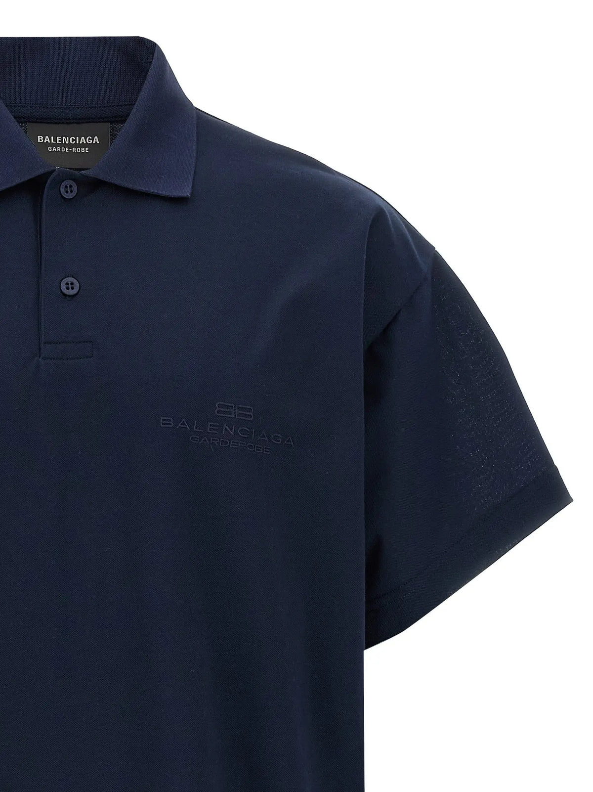 Polo bleu marine balenciaga en coton avec logo brodé discret sur la poitrine et détail texturé sur la manche