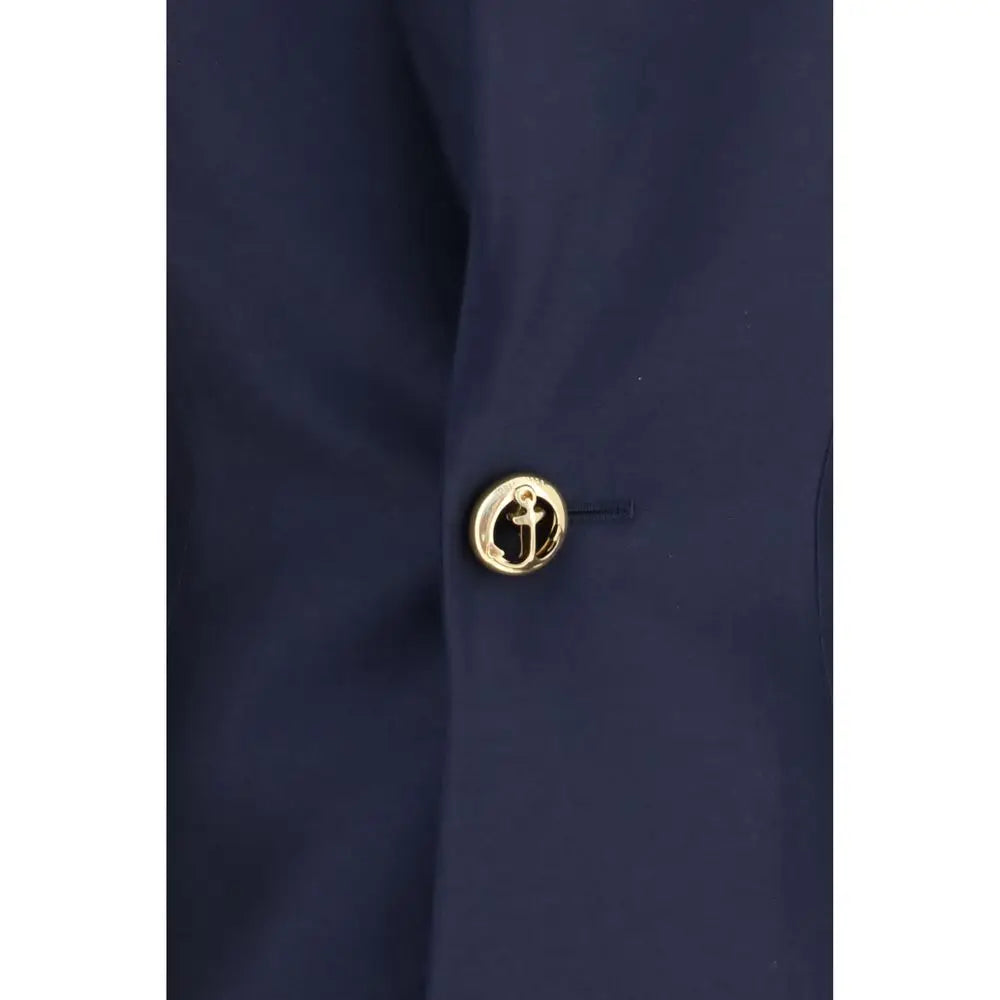 Bouton en forme dancre doré sur tissu bleu marine robe casual en laine bleue balenciaga oves aries