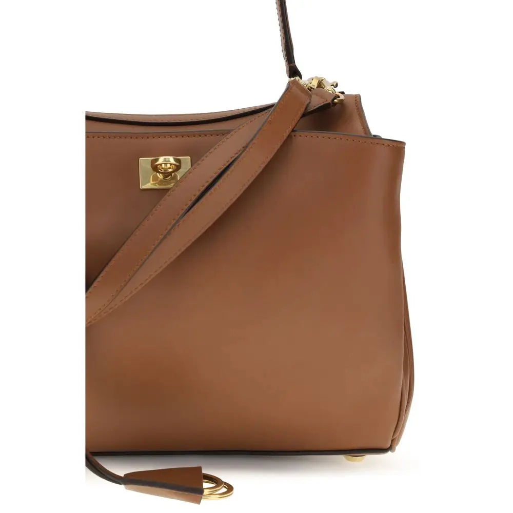 Sac à main balenciaga bos taurus en cuir de veau marron avec ferrures dorées et design minimaliste structuré