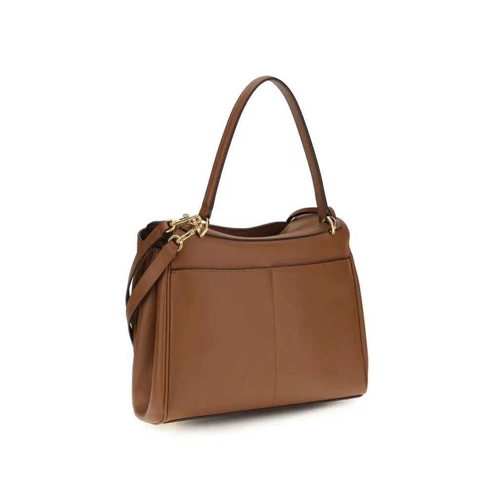 Sac à bandoulière balenciaga bos taurus en cuir de veau marron avec matériel doré et forme rectangulaire structurée