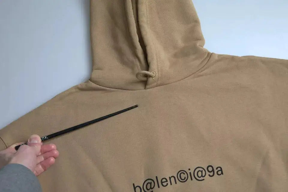 Sweat à capuche balenciaga marron en coton bouclette avec logo noir et cordon de serrage
