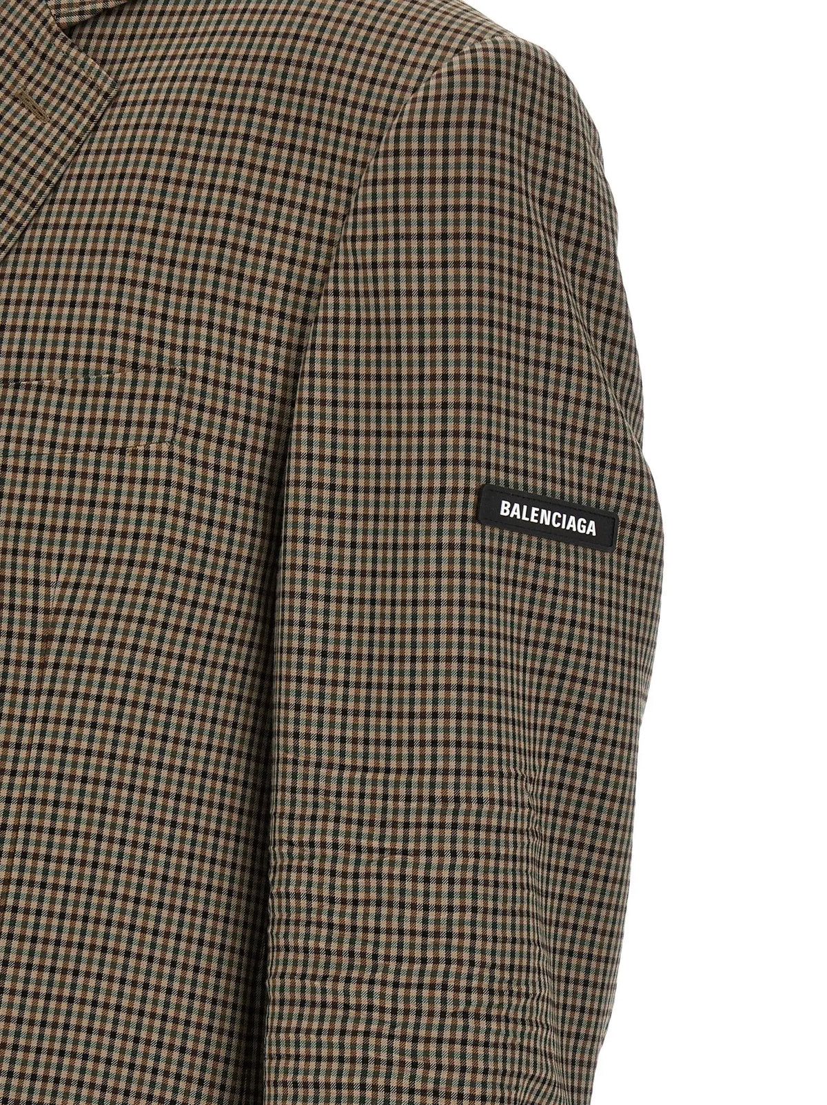 Manche de blazer balenciaga marron à carreaux noirs en lyocell avec étiquette noire contrastante visible