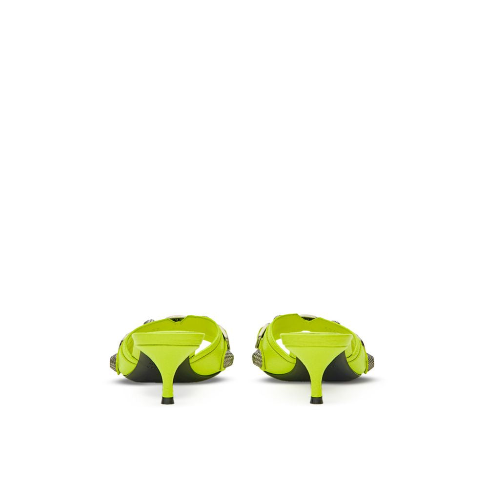 Mules en cuir jaune de Balenciaga, élégantes et modernes, avec semelle plate et design sophistiqué.