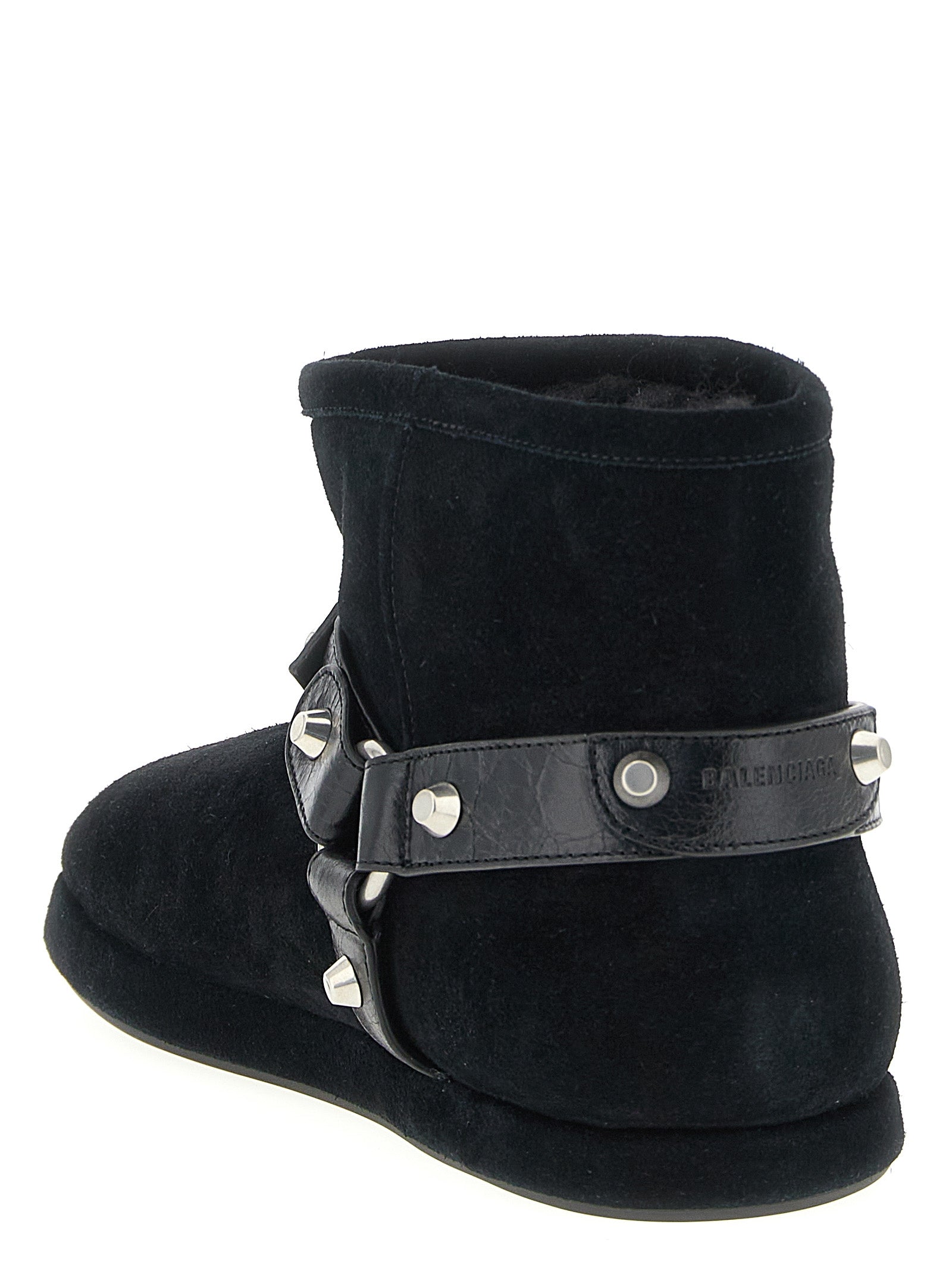 Bottes ankle en cuir de veau noir Balenciaga, élégantes et modernes, vues de face avec détails du talon et des lacets.