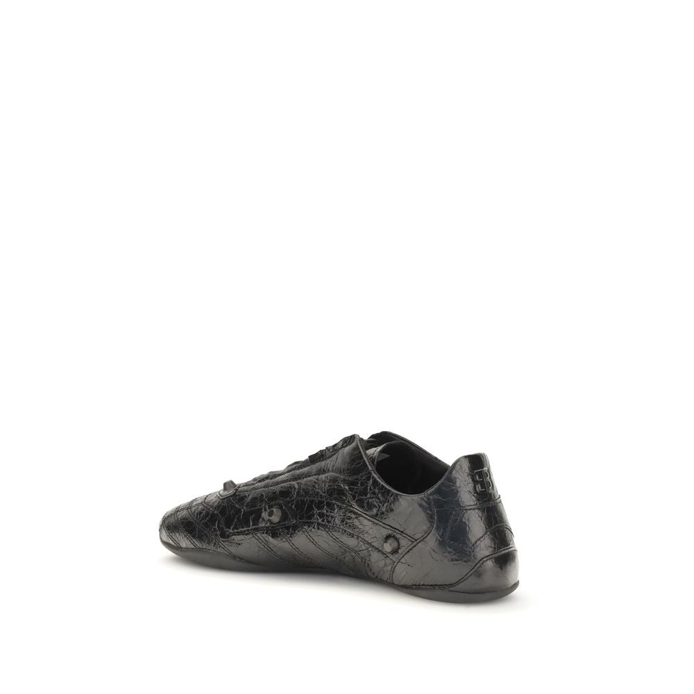 Chaussures Balenciaga Bos Taurus en cuir de veau noir, baskets athlétiques élégantes et modernes avec semelle blanche.