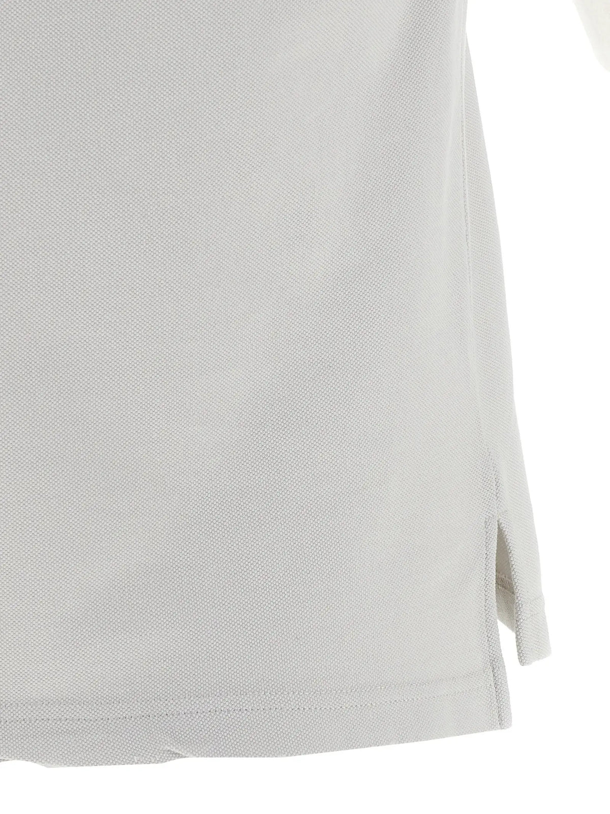 Polo gris balenciaga en coton avec tissu piqué texturé et fente latérale subtile au bas