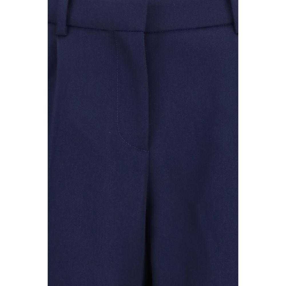 Pantalon en laine bleue Balenciaga Oves Aries avec coupe décontractée et détails modernes, porté par un mannequin.