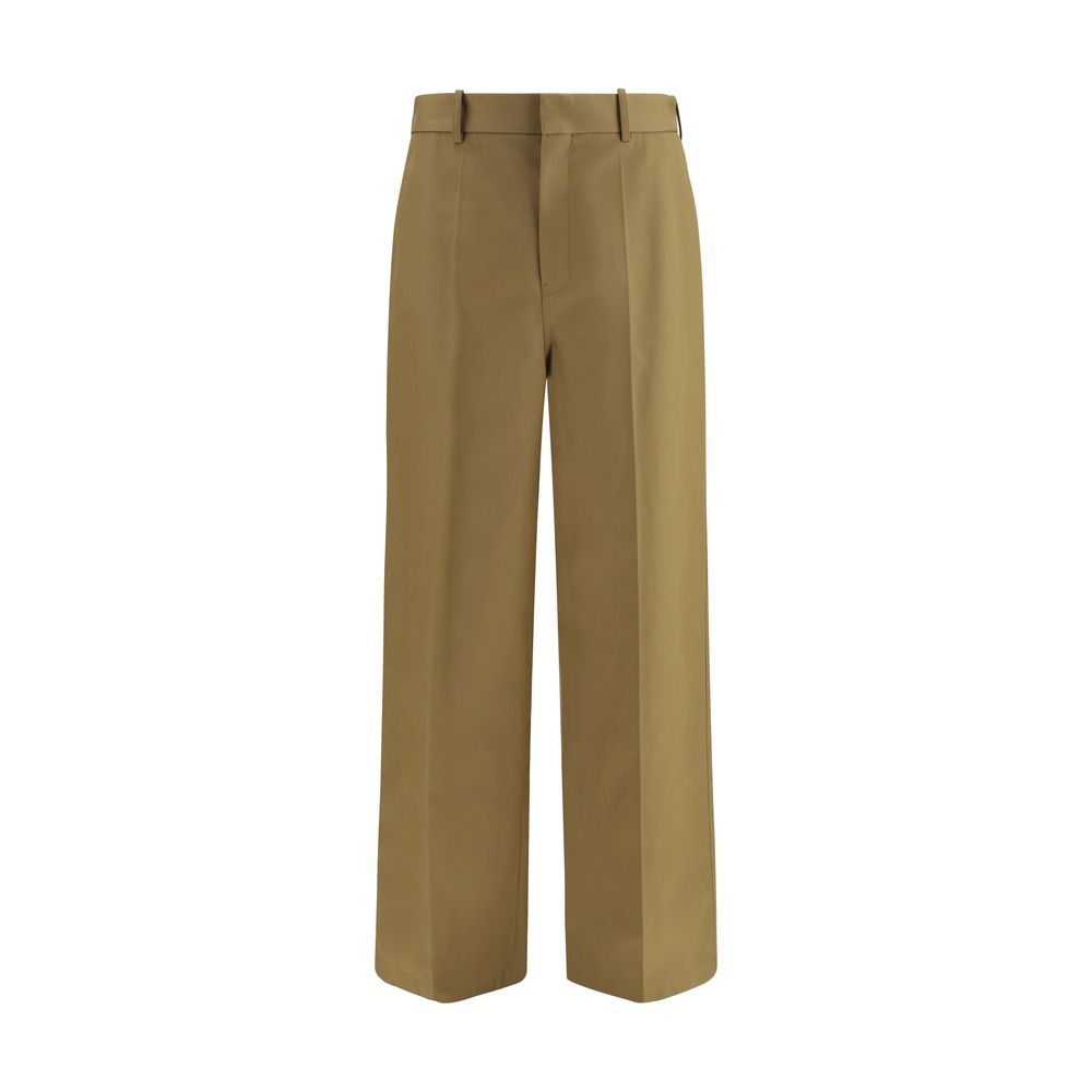 Pantalon chino beige en coton de la marque Balenciaga, coupe classique et détails modernes.