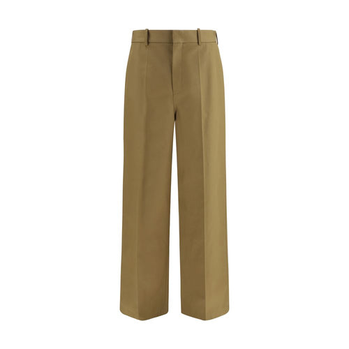 Pantalons chino en coton beige de Balenciaga, style décontracté et élégant, visibles avec une coupe classique et détails soignés.