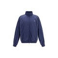Veste en coton bleue de Balenciaga, shell légère avec fermeture éclair et col montant, vue de face.