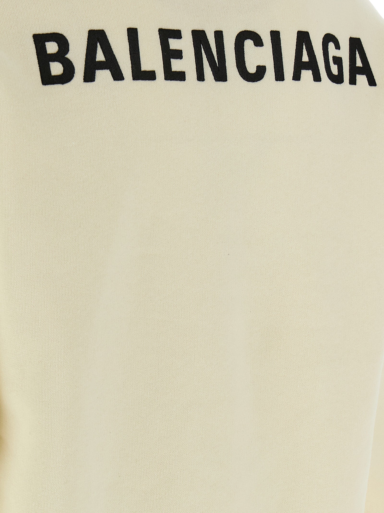 Sweat-shirt beige en coton de Balenciaga, vue de face, avec logo discret et coupe décontractée.