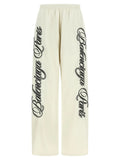Pantalon de sport balenciaga multicolore en polyamide crème large avec logo cursif noir le long des jambes