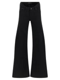 Jeans évasés en coton noir de la marque Balenciaga, montrant la coupe flared et la texture du tissu.