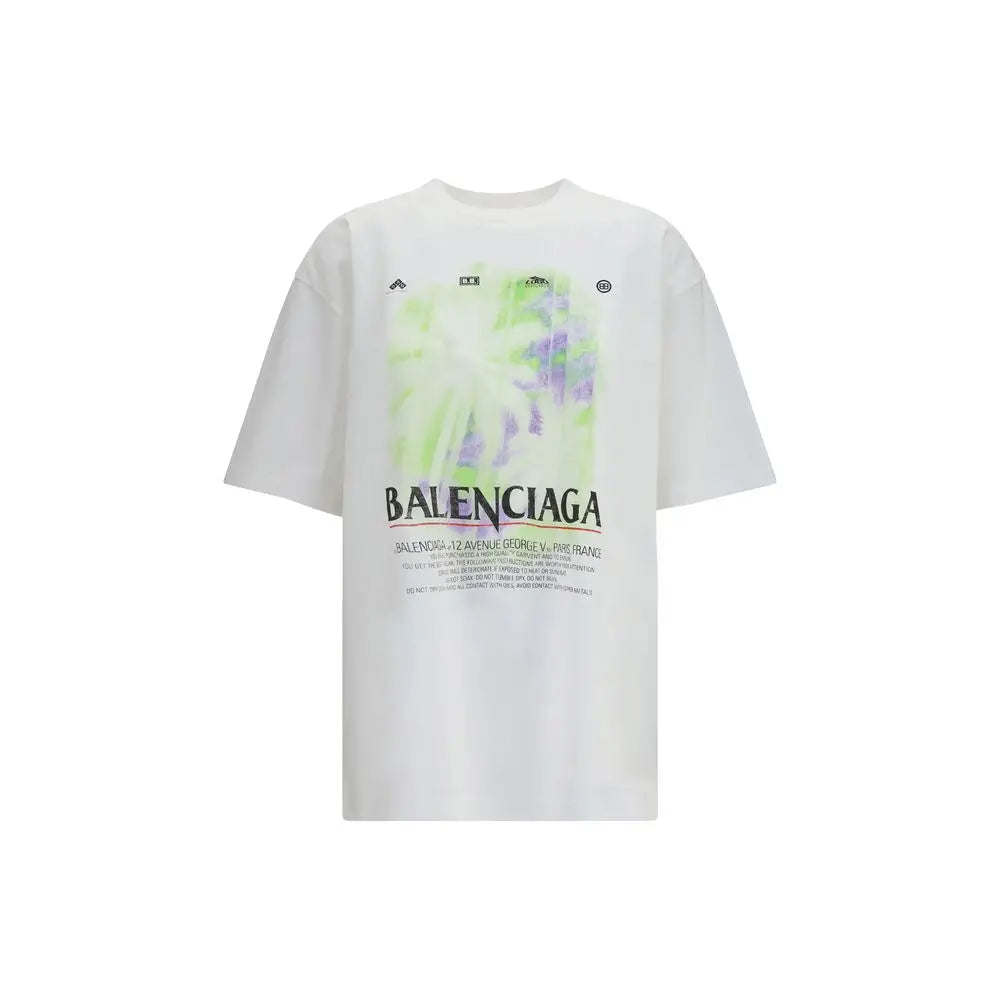 T-shirt balenciaga blanc en coton avec imprimé graphique audacieux floral vert et violet au-dessus du nom de la marque