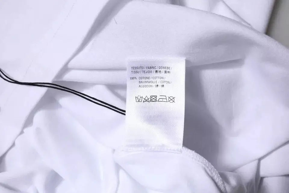 Étiquette de soin en coton blanc avec texte multilingue et symboles de lavage pour t-shirt balenciaga blanc en jersey coton