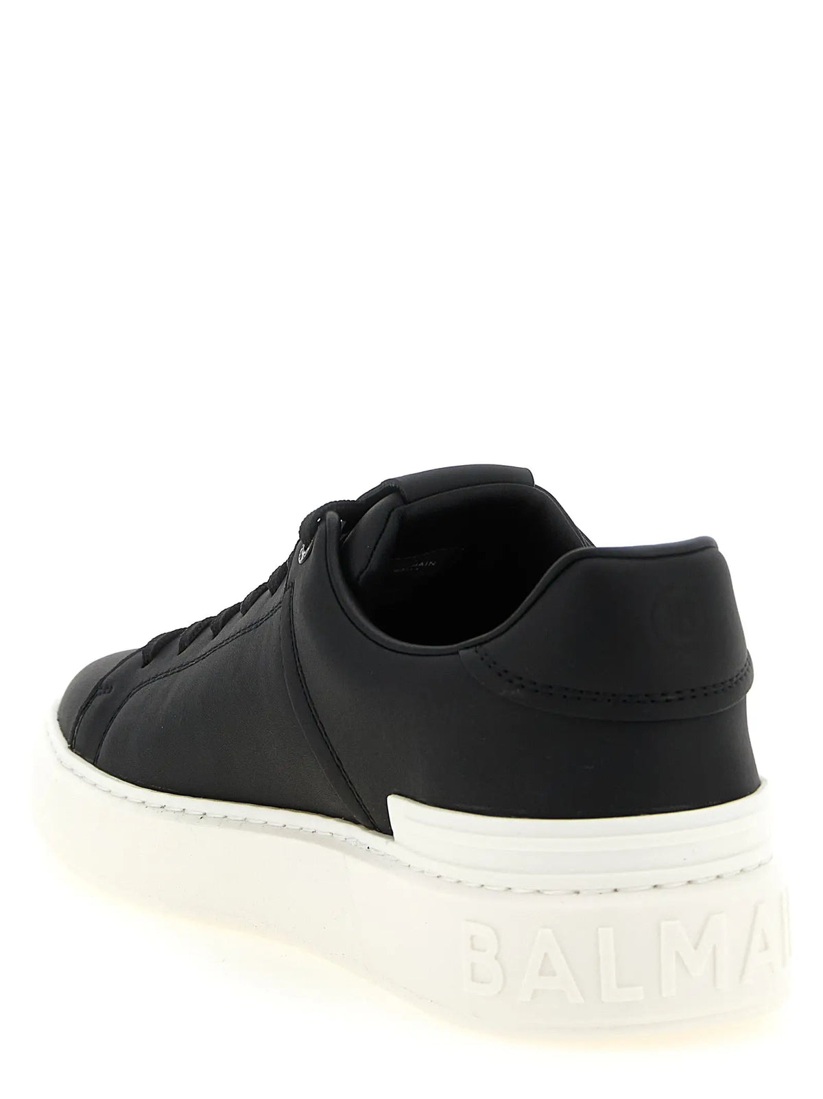 Baskets basses balmain en cuir de veau bicolore noires avec semelle en caoutchouc blanche et détails cousus