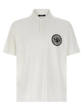 Polo blanc balmain en coton avec logo circulaire noir brodé sur la poitrine gauche