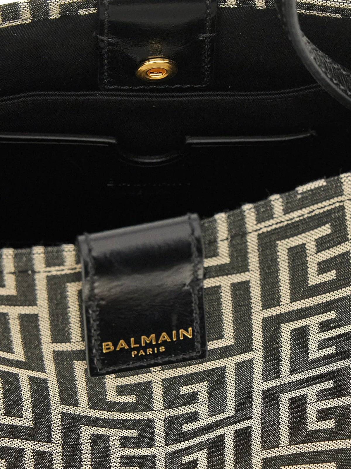 Sac balmain paris en coton bicolore noir et crème avec motif géométrique et fermoir métal doré brillant