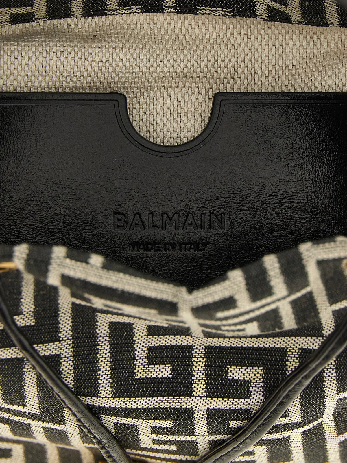 Écusson en cuir noir embossé balmain made in italy sur intérieur en toile beige texturée du sac à main balmain bicolor polyester