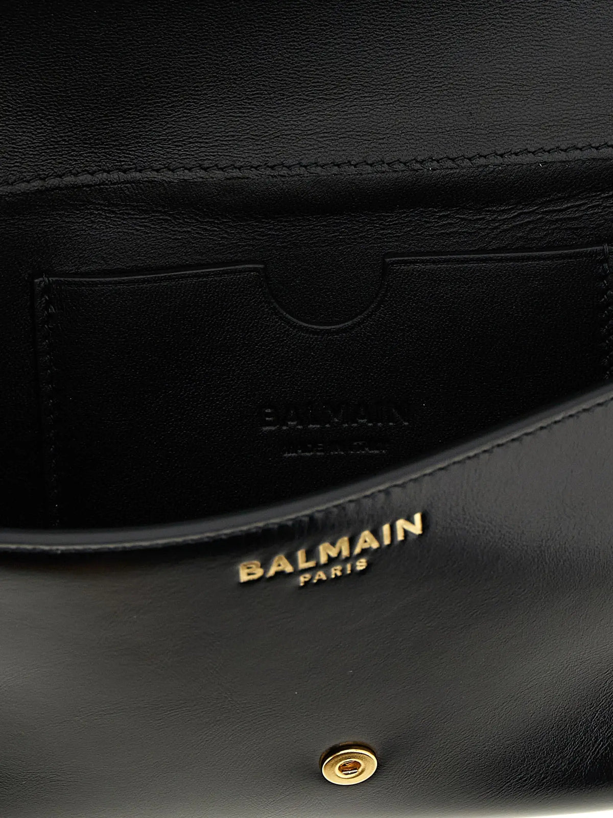 Balmain black calfskin leather clutch with gold-tone hardware and embossed branding for elegant use