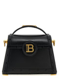 Sac à main balmain en cuir de veau noir avec une quincaillerie dorée et un logo circulaire proéminent