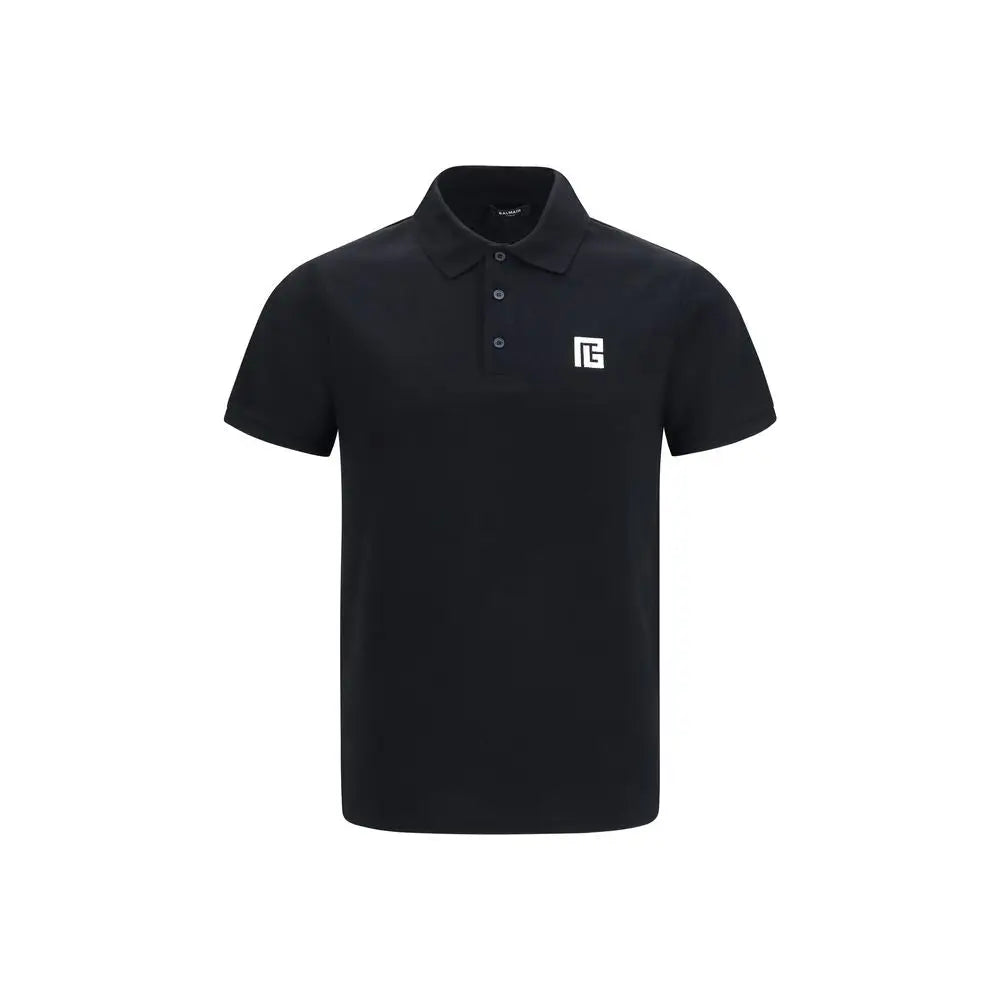 Balmain polo noir en coton à manches courtes avec logo blanc sur la poitrine et boutons assortis