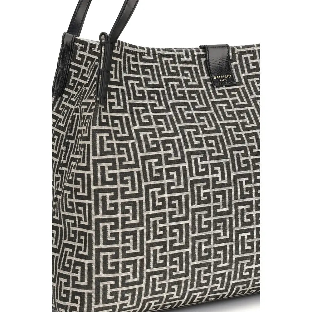 Sac bandoulière en coton noir balmain avec motif géométrique noir et blanc et anses en cuir noir
