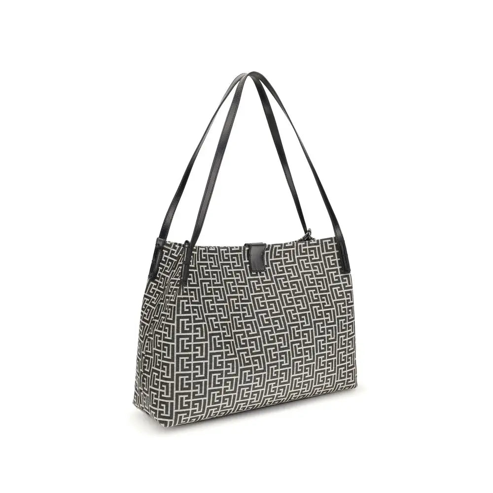 Sac à épaule balmain en coton noir avec motif géométrique noir et blanc et anses en cuir élégantes
