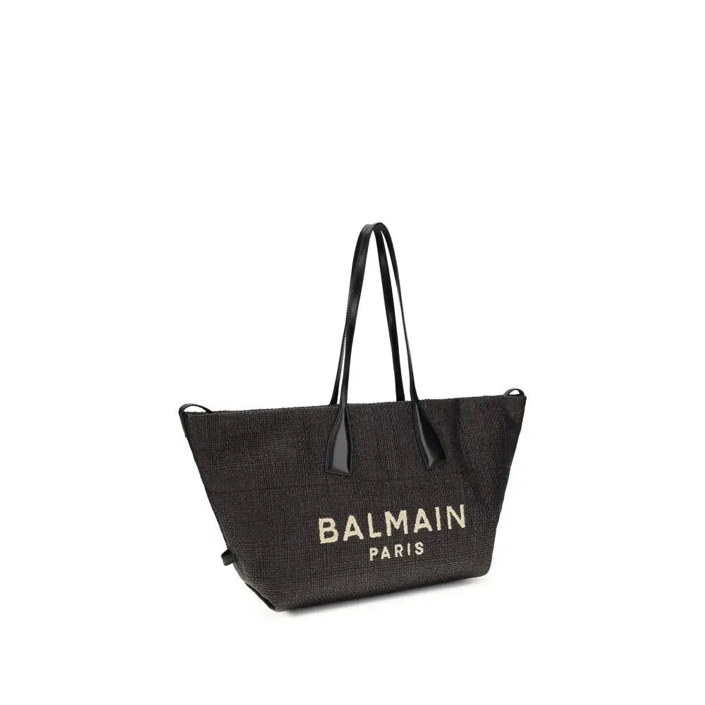 Sac bandoulière balmain noir en raphia tissé avec logo balmain paris en lettres dorées et anses en cuir noir
