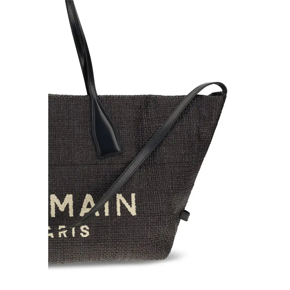 Sac cabas balmain noir en raphia tressé avec poignées en cuir noir et logo balmain paris crème visible