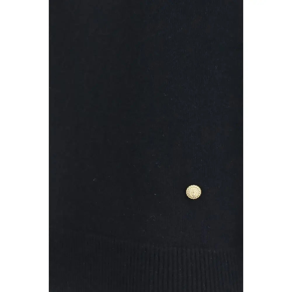 Petit bouton rond doré à motif soleil sur pull sans manches balmain noir en laine oves aries