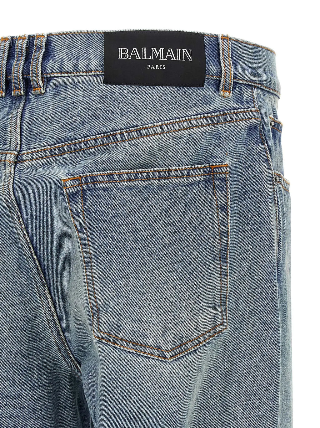 Jean denim balmain bleu clair en coton avec poche arrière classique et étiquette noire balmain paris à la taille vue dos