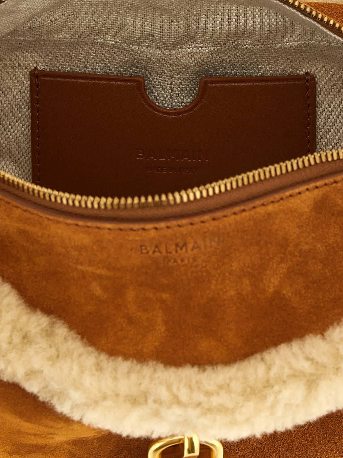 Intérieur en daim marron et doublure en shearling crème de sac épaule balmain en veau avec fermeture éclair dorée