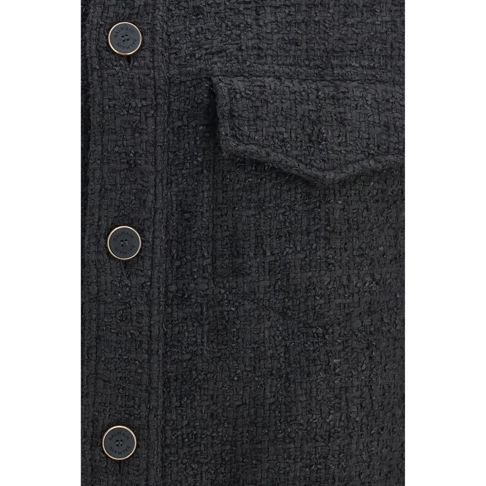 Veste en coton noire Balmain, coupe shell, vue de face avec détails de design moderne, idéale pour un style élégant et décontracté.