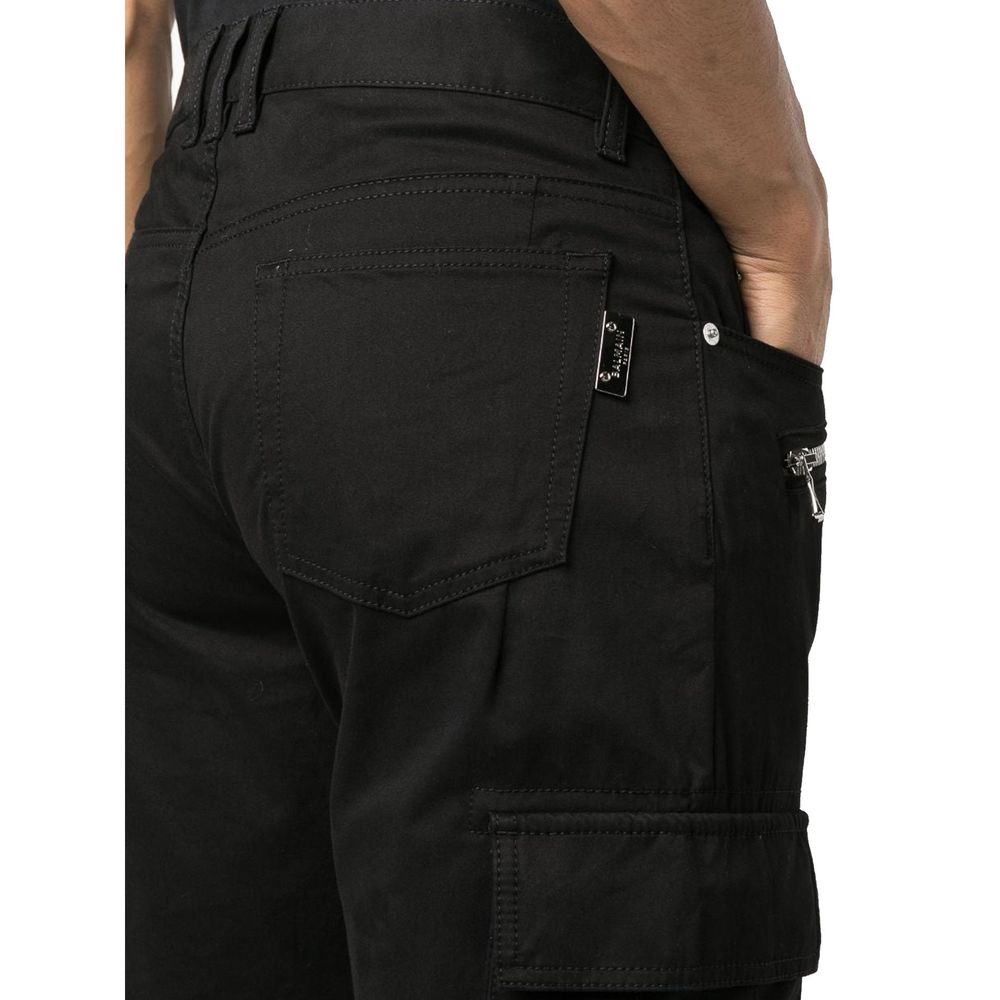 Pantalons cargo noirs en coton de la marque Balmain, avec poches latérales et coupe décontractée.