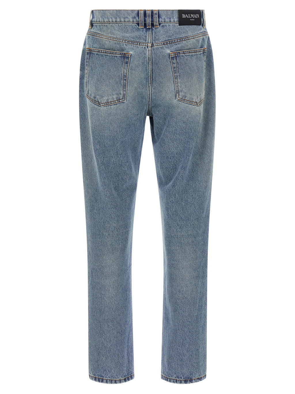Jeans en denim bleu en coton de la marque Balmain, coupe classique et détails de couture visibles.