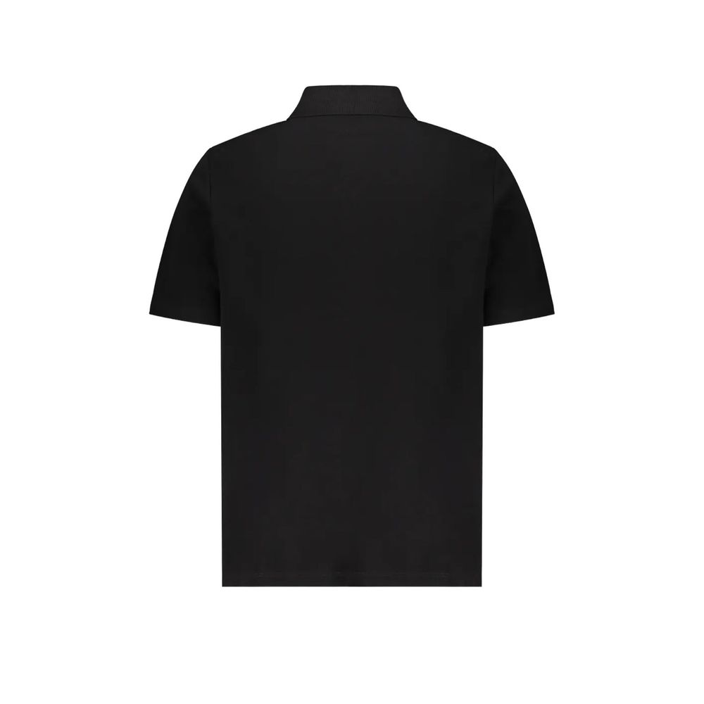 Chemise polo noire en coton de la marque Balmain, vue en gros plan avec col et boutons visibles.