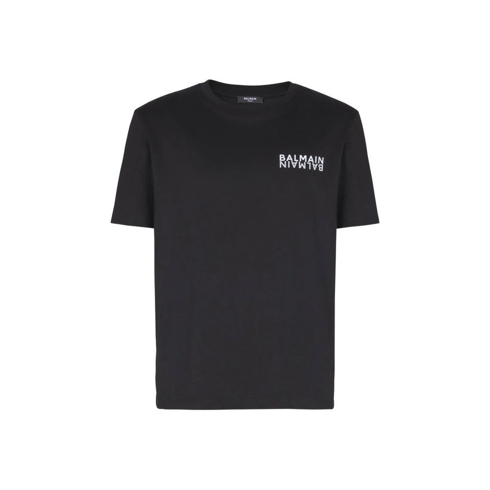 T-shirt en coton noir de Balmain, coupe classique, porté sur mannequin, vue de face, détails du tissu et logo subtil visible.