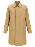 Manteau en coton beige Burberry pour femme, coupe classique avec col et boutons, parfait pour un look élégant et décontracté.