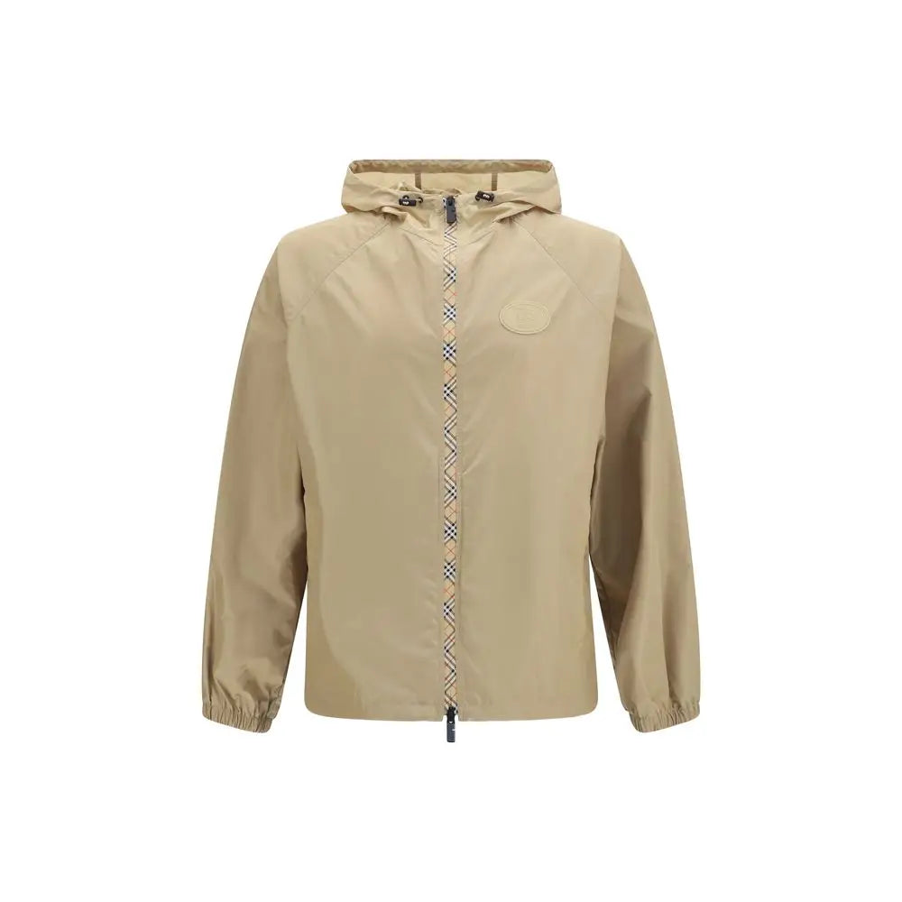 Veste burberry beige en nylon avec capuche, fermeture éclair à motif check distinctif et poche poitrine discrète