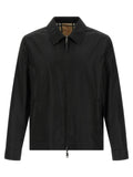 Veste burberry noire en polyamide avec col classique et doublure à carreaux signature visible sur le revers