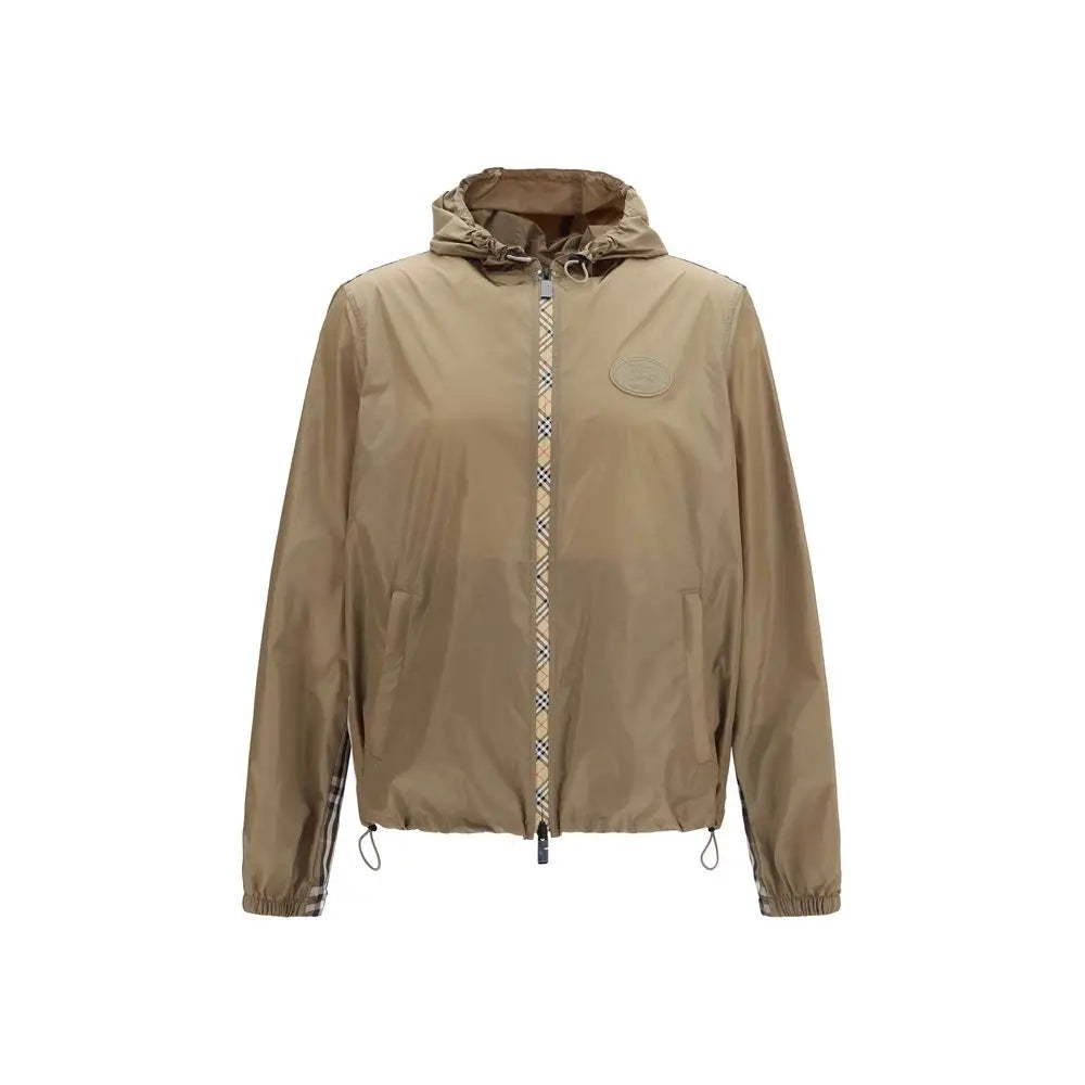 Beige burberry brown nylon shell jacket with hood and distinctive check pattern along zipper and sleeve cuffs