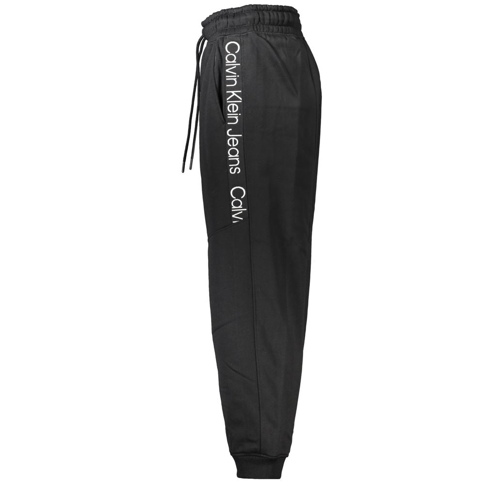 Pantalons de jogging pour femmes Calvin Klein en polyester noir, coupe décontractée et confortables, visibles à l'image.