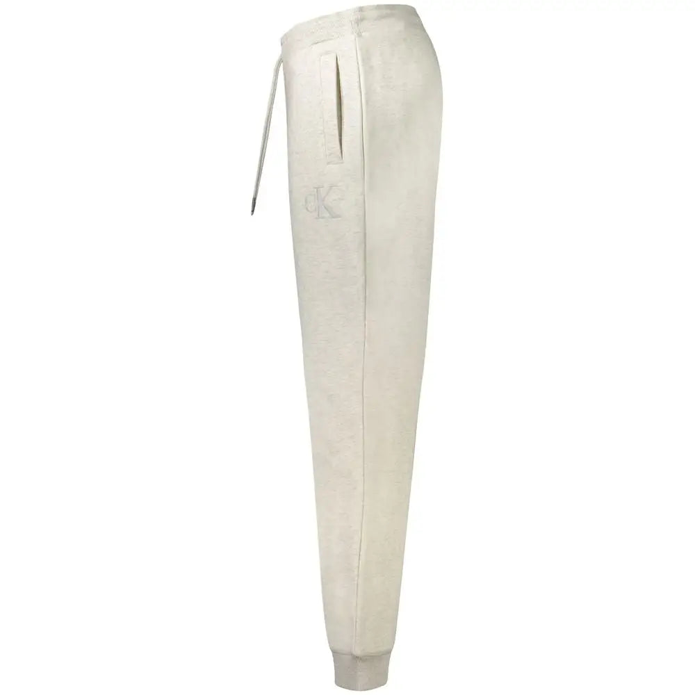 Calvin klein grey cotton men’s jogger pant in cream color with soft textured fabric and subtle logo on the thigh