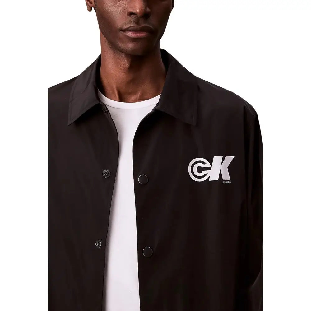 Veste coach noire calvin klein jeans en polyester avec logo blanc ck sur la poitrine gauche