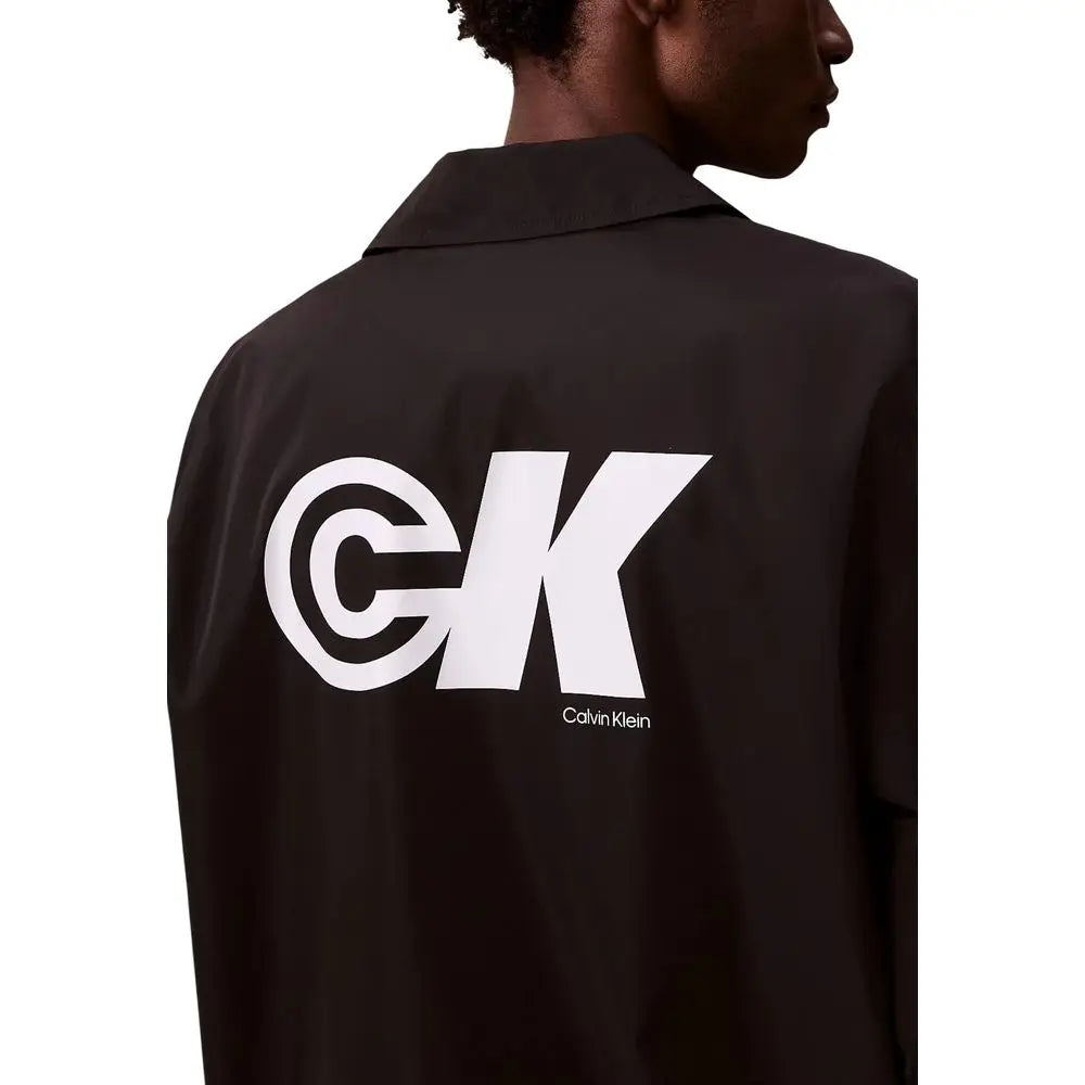 Veste calvin klein jeans noire en polyester avec grand logo ck blanc visible sur le dos